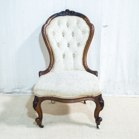 An Early Victorian Walnut Nursing Chair
