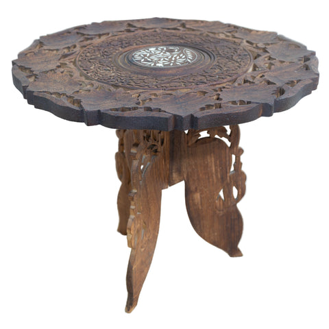 Indian carved side table. Furniture store.